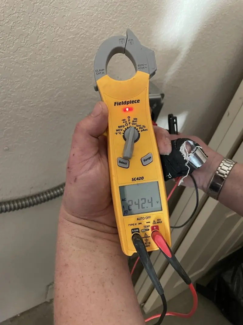 Voltage testing with clamp meter during Circuit Breaker Repair in Hamilton
